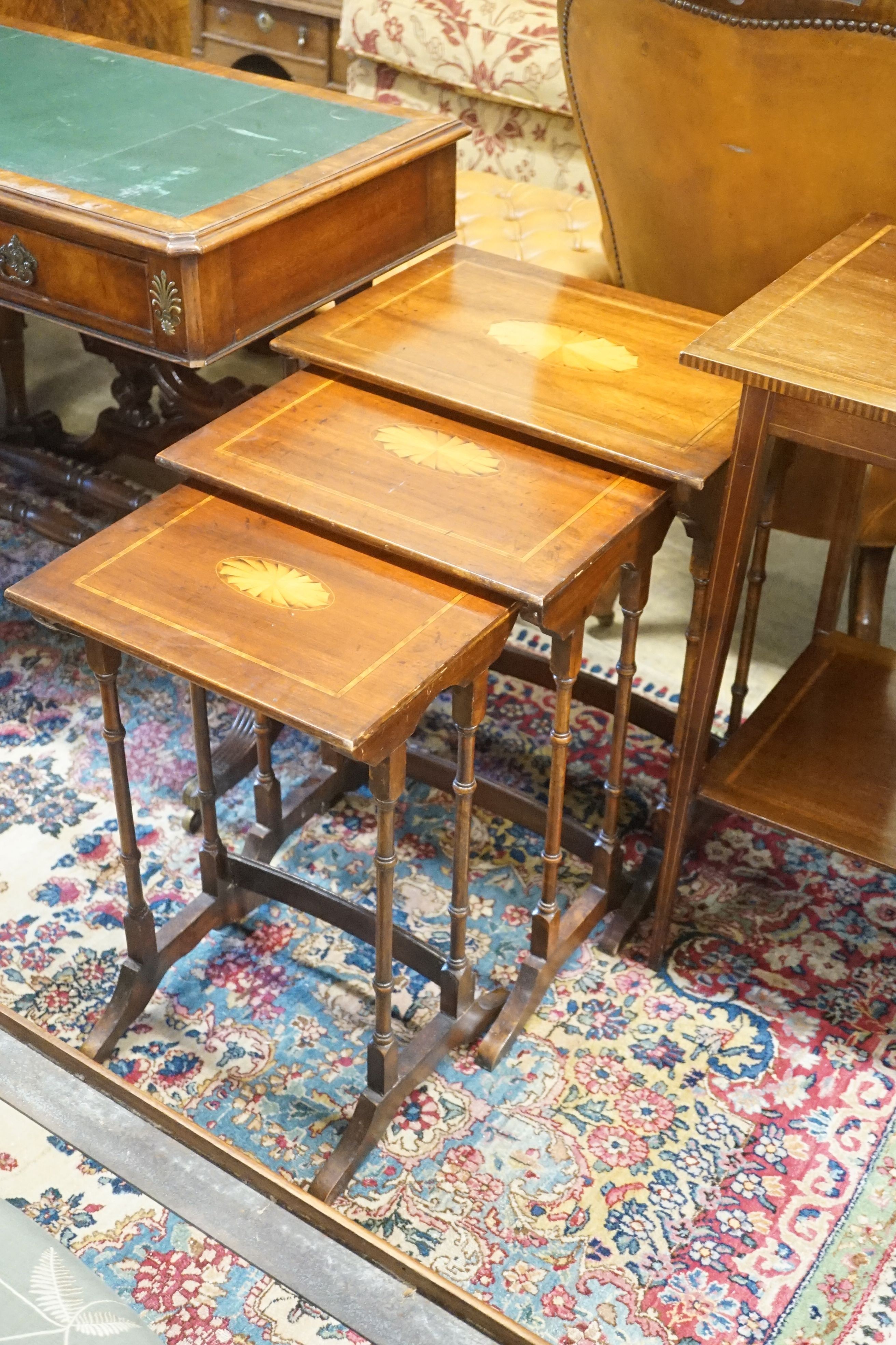 An Edwardian satinwood banded two tier occasional table, wdith 43cm depth 43cmm height 72cm, together with a nest of three inlaid mahogany tea tables